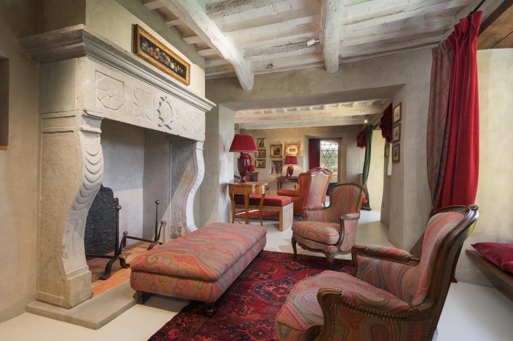 Cortona Escape living room, featuring a gorgeous stone fireplace