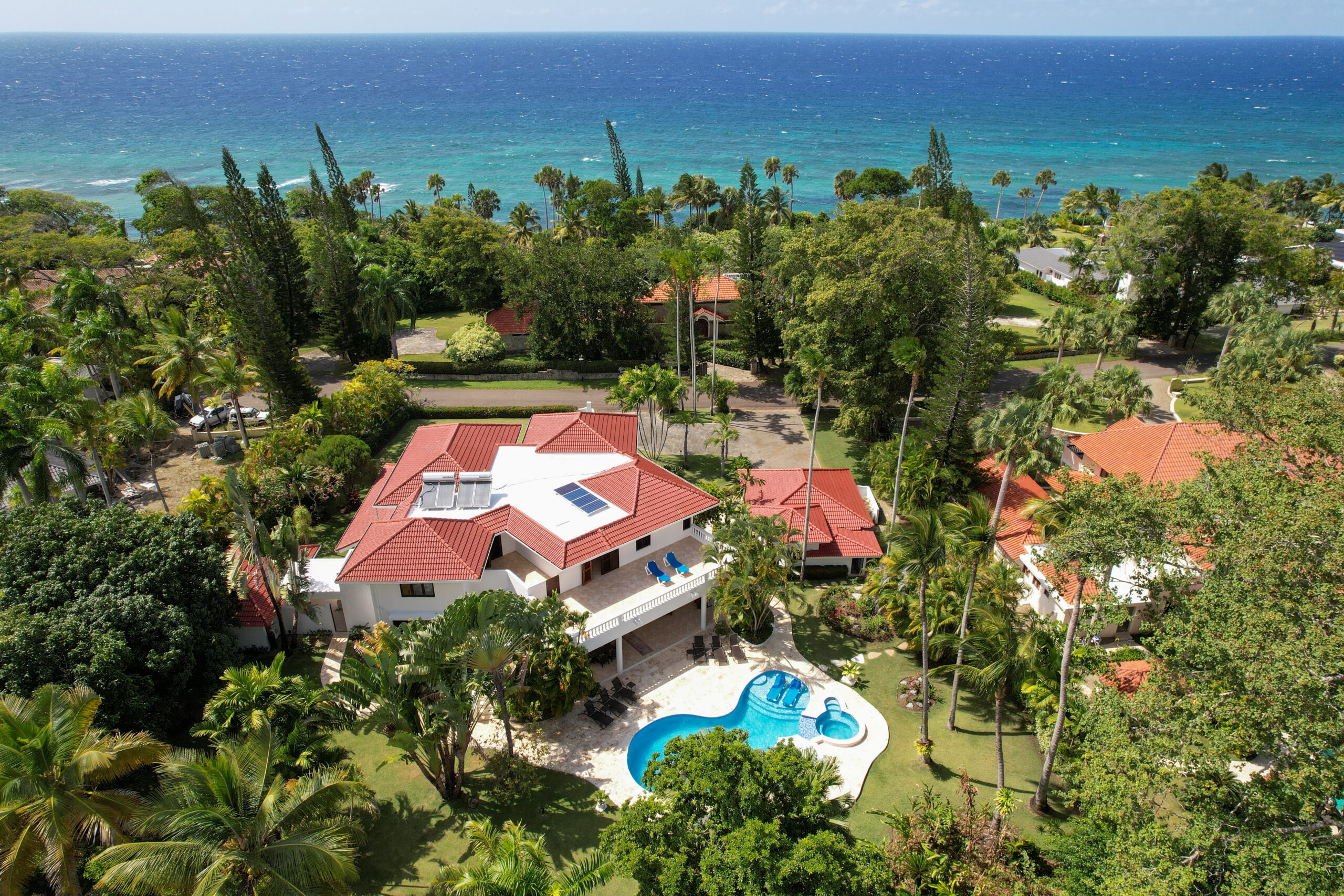 Overview of the Cabarete Dreams property showing the luxurious pool in the foreground and the ocean in the background