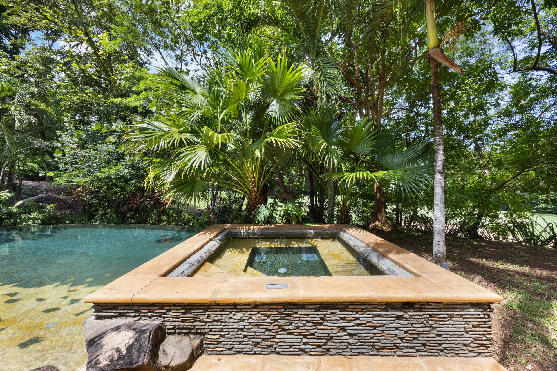 The Jacuzzi style outdoor tub at Villa Conchal, which sits next to and just above the pool