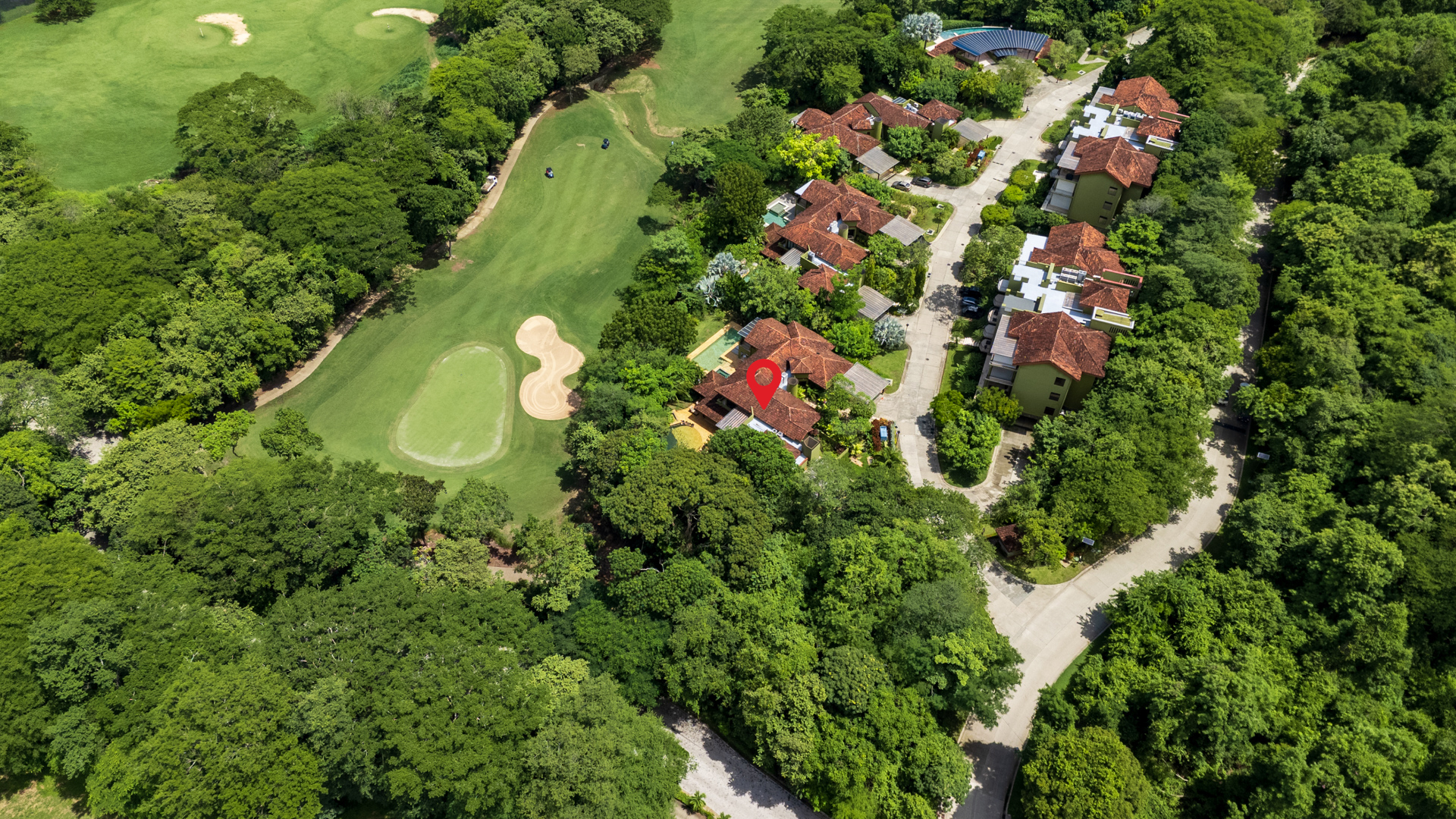 Aerial view of part of the championship golf course at Villa Conchal, highlighting the home's proximity to the course